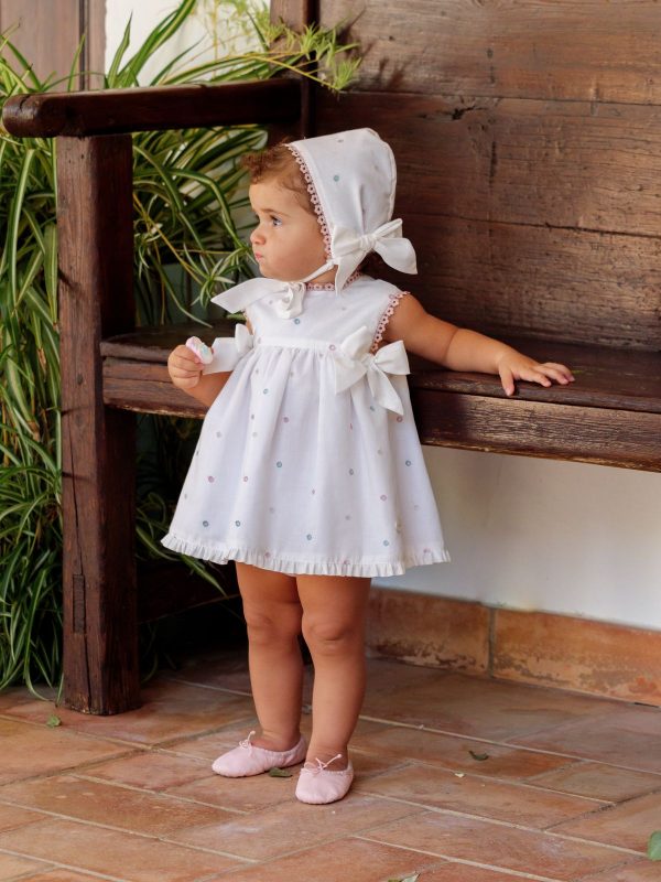 Conjunto vestido, braguita y capota perforado rosa lazos bebé | Cocote by Charanga