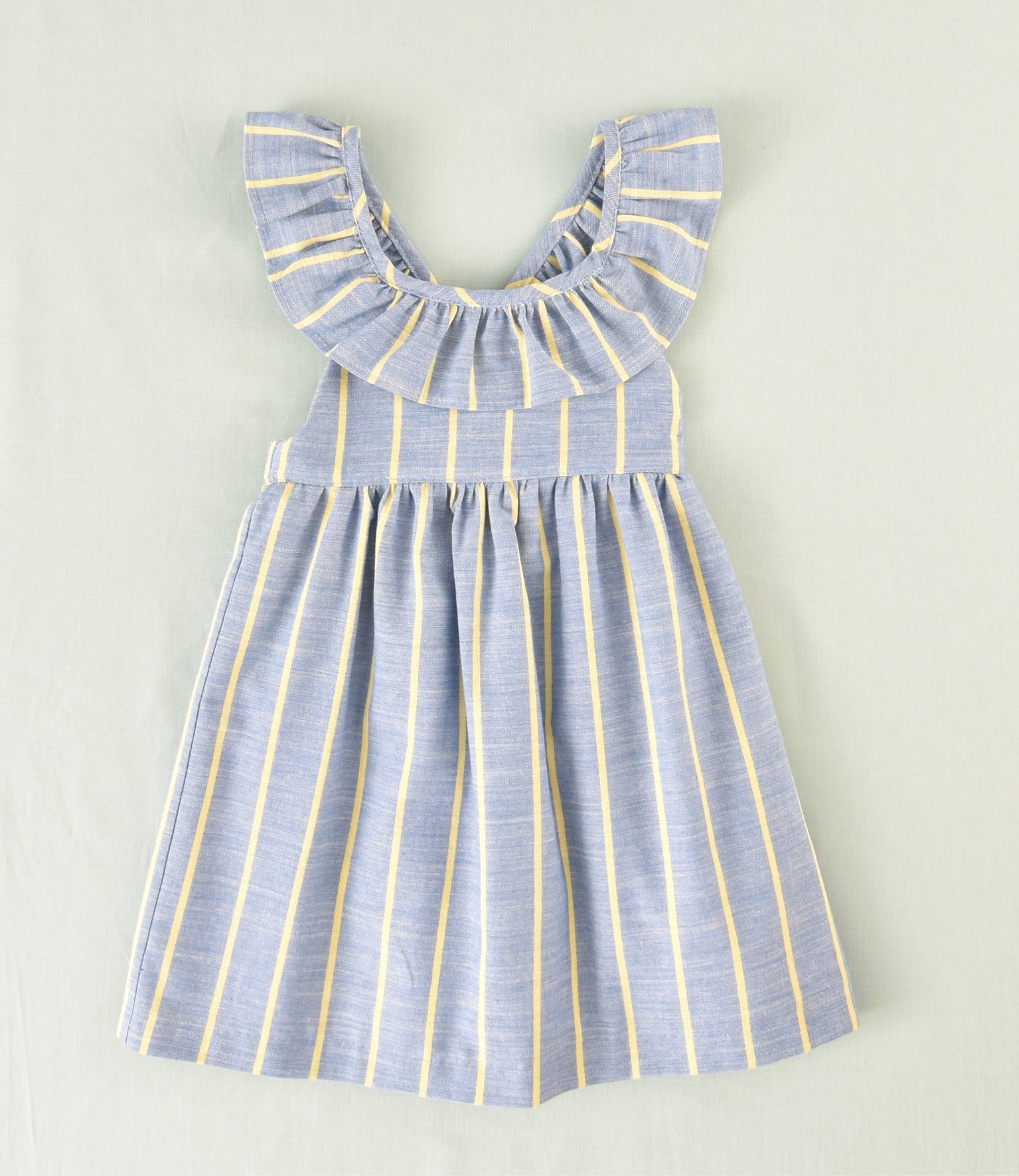 Vestido azul rayas amarillas con volante | Cocote & Charanga