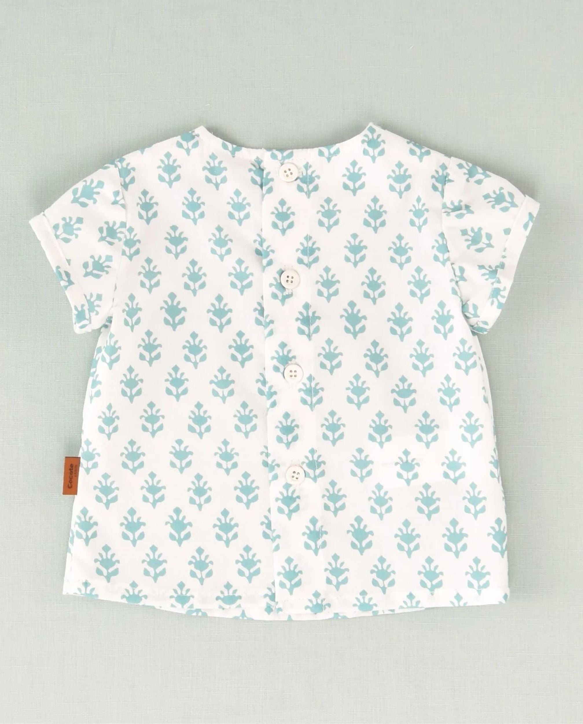 Camisa de flores blanca y turquesa bebé niño
