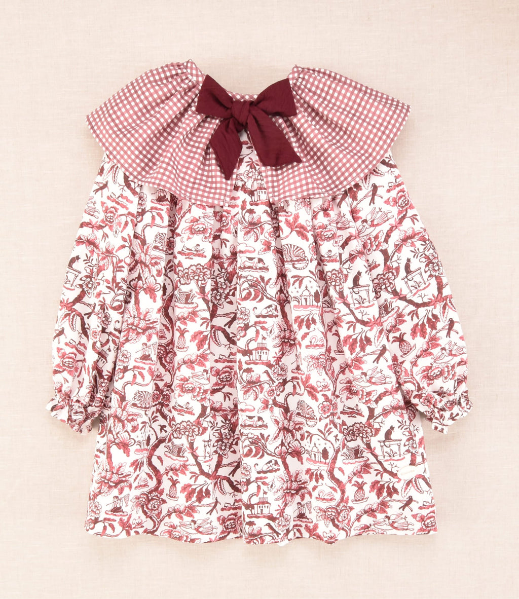 Vestido flores burdeos para niña vista frontal con volante y lazo burdeos Charanga