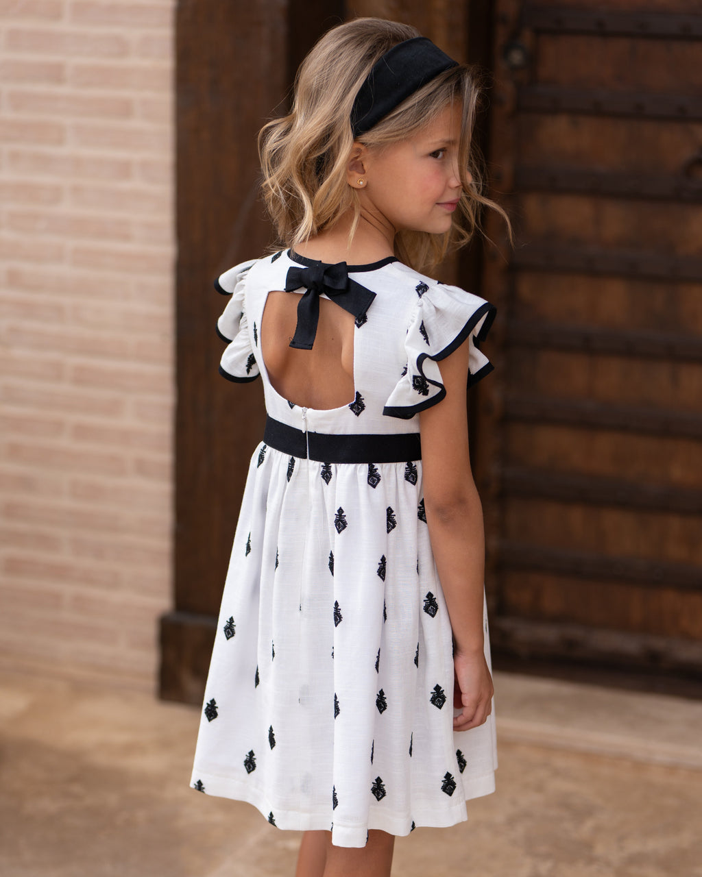 Vestido niña bordado negro con lazo | Cocote by Charanga