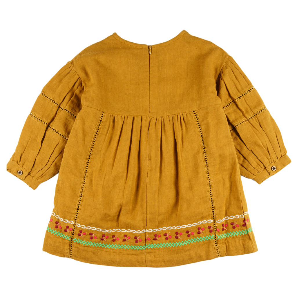 Vestido niña mostaza bambula bordado con borlas