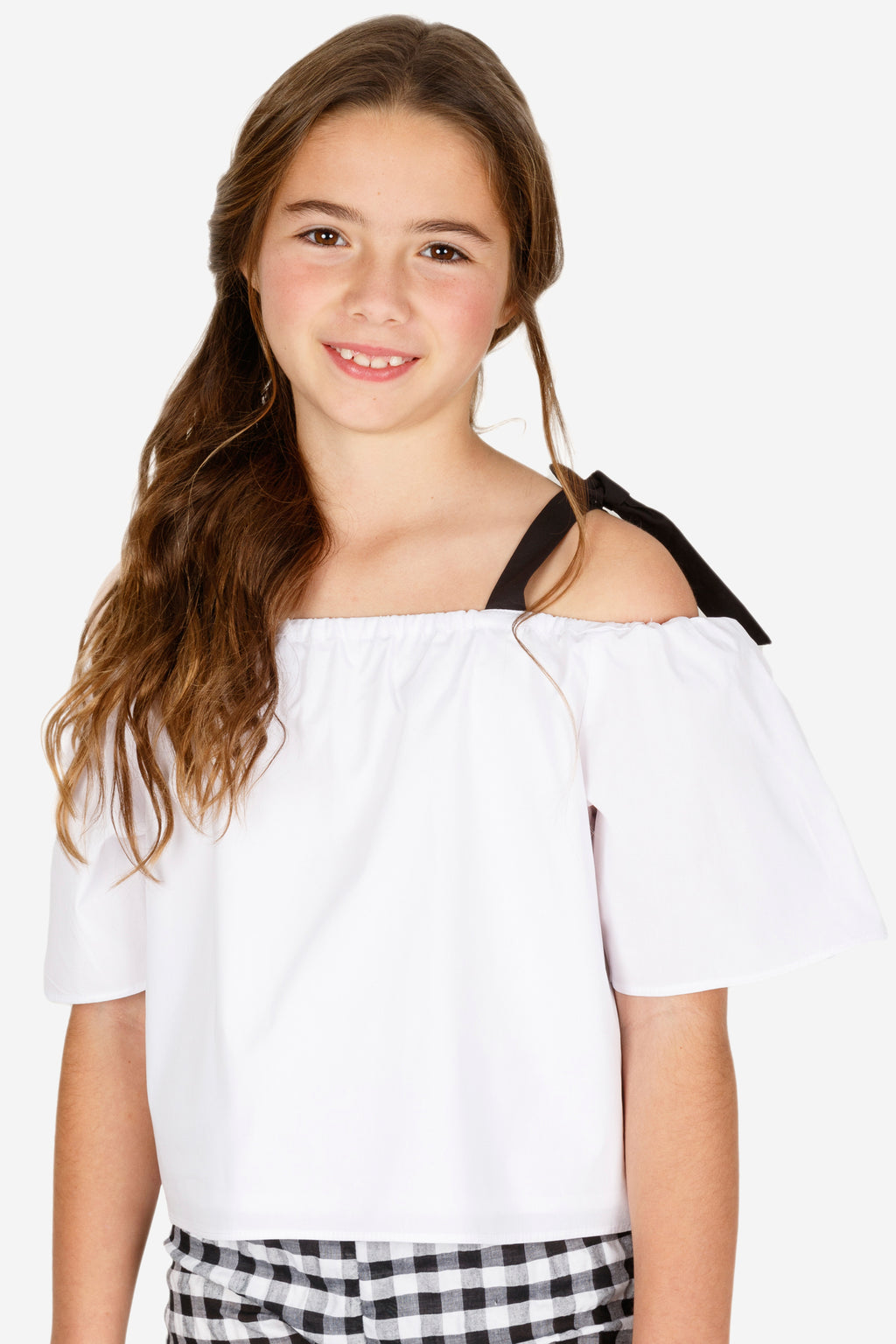Blusa niña blanca con lazos negros