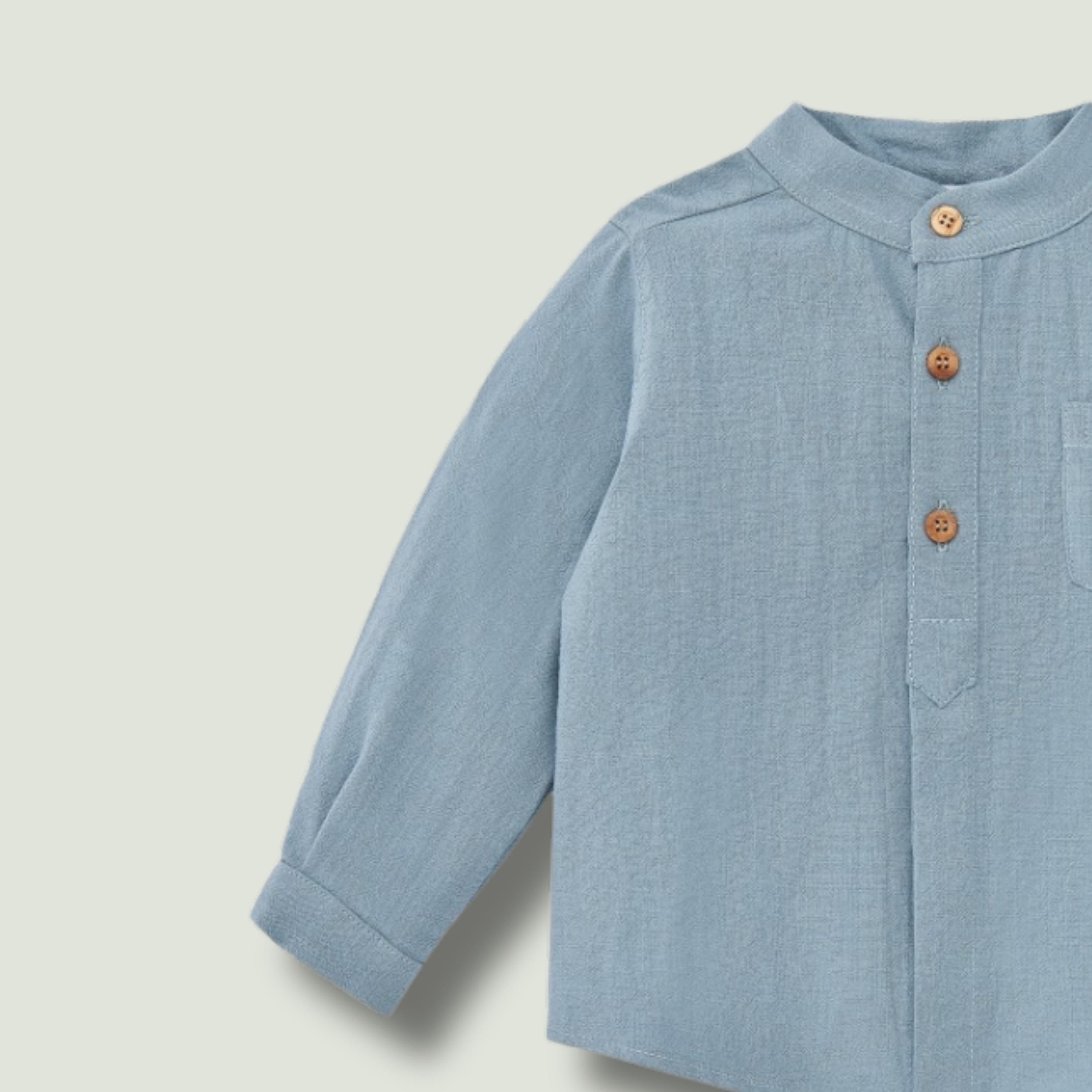 Light blue child's blouse with Cocote & Charanga sleeves